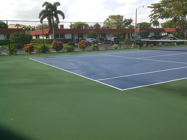 view of sport court with basketball hoop