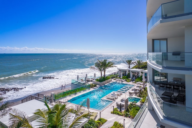 property view of water featuring a beach view