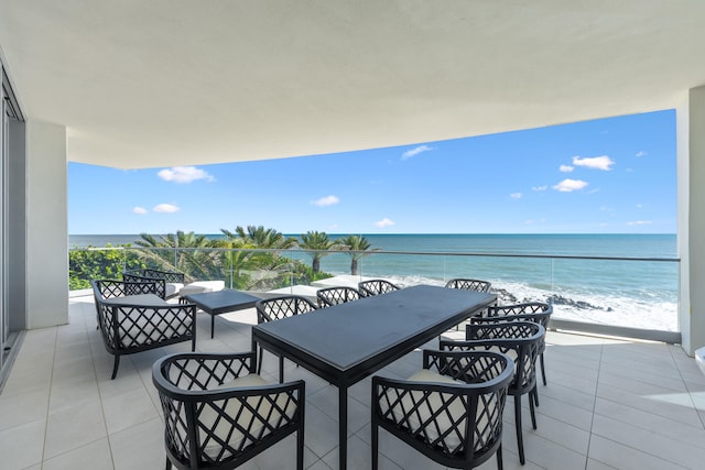 balcony with a beach view and a water view