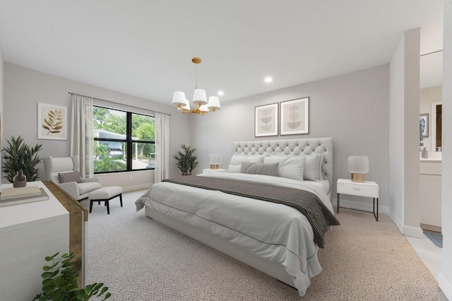 carpeted bedroom with a notable chandelier