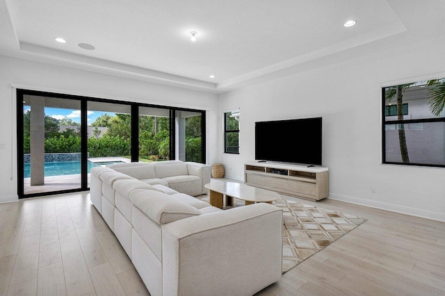 13450 Artisan Cir, Palm Beach Gardens, FL 33418 - living area with a raised ceiling, healthy amount of natural light, and recessed lighting