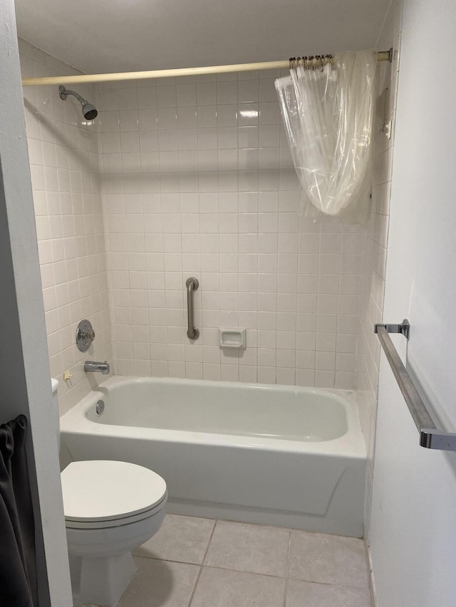 bathroom with tile patterned flooring, shower / bath combination with curtain, and toilet