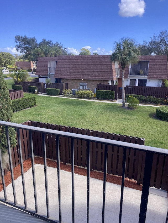 view of property's community with a lawn