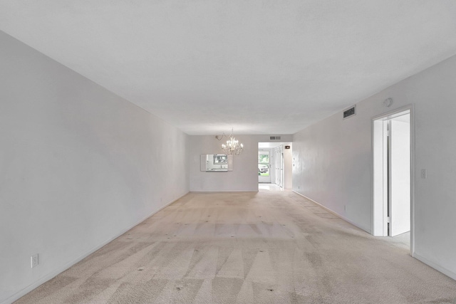 60 Yacht Club Dr Unit 106, North Palm Beach, FL 33408 - spare room with a chandelier and carpet flooring