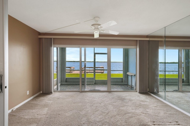 60 Yacht Club Dr Unit 106, North Palm Beach, FL 33408 - carpeted spare room with a water view, a ceiling fan, healthy amount of natural light, and baseboards