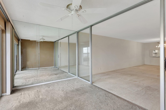 interior space featuring ceiling fan