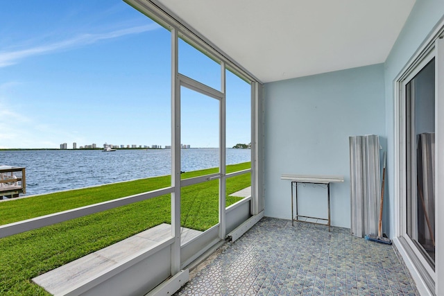 sunroom / solarium with a water view