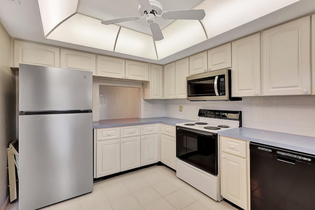 60 Yacht Club Dr Unit 106, North Palm Beach, FL 33408 - kitchen featuring stainless steel appliances, ceiling fan, backsplash, light tile patterned floors, and cream cabinets