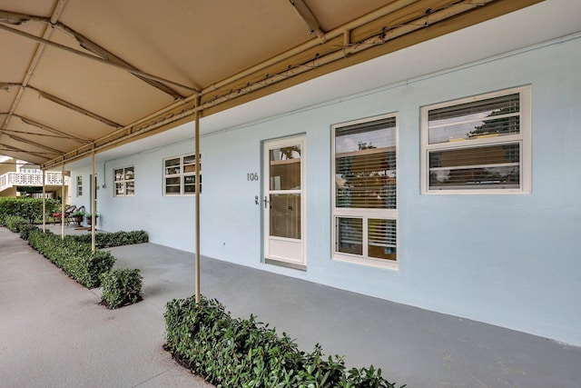 60 Yacht Club Dr Unit 106, North Palm Beach, FL 33408 - doorway to property with stucco siding