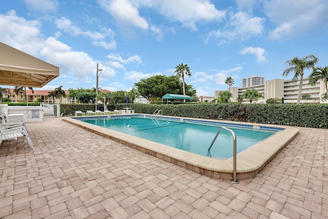 view of swimming pool with a patio area