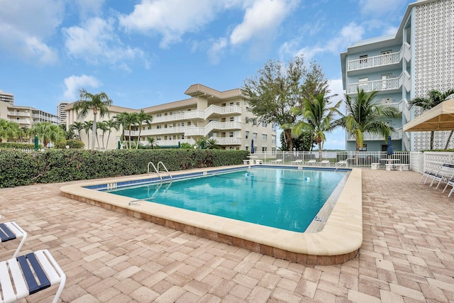 view of swimming pool with a patio