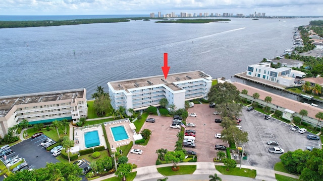 60 Yacht Club Dr Unit 106, North Palm Beach, FL 33408 - drone / aerial view of a large body of water, a pool, and apartment complex / building