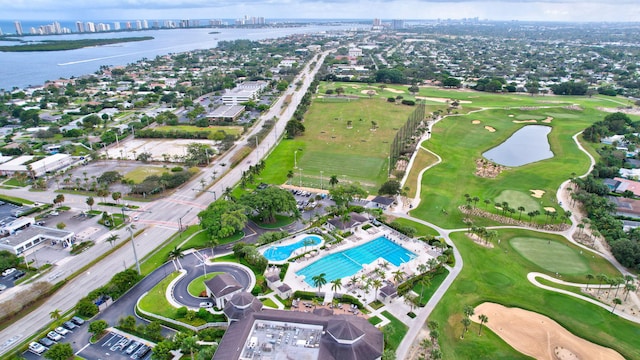 60 Yacht Club Dr Unit 106, North Palm Beach, FL 33408 - aerial overview of property's location with a large body of water, nearby urban area, a pool, and a golf club