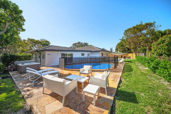 view of patio / terrace with a pool with hot tub