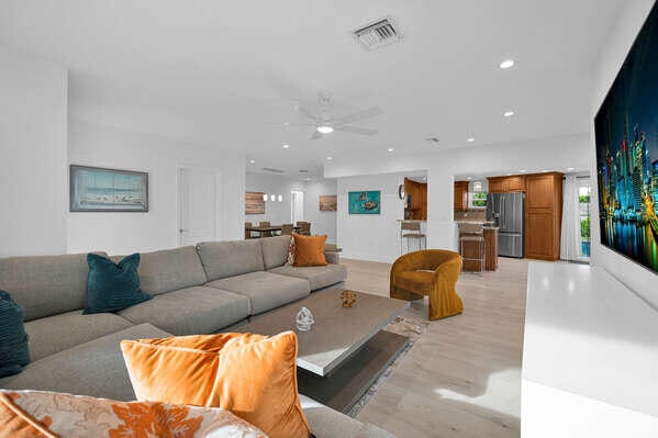 living room featuring ceiling fan and light hardwood / wood-style flooring