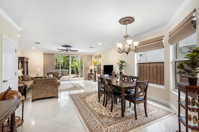 tiled dining space with ceiling fan with notable chandelier and crown molding