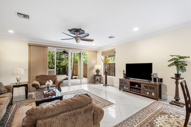 living room featuring ceiling fan, light tile patterned floors, and ornamental molding