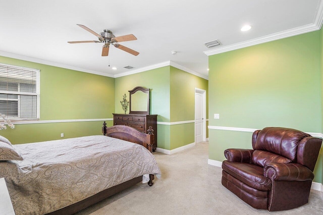 carpeted bedroom featuring ceiling fan and crown molding