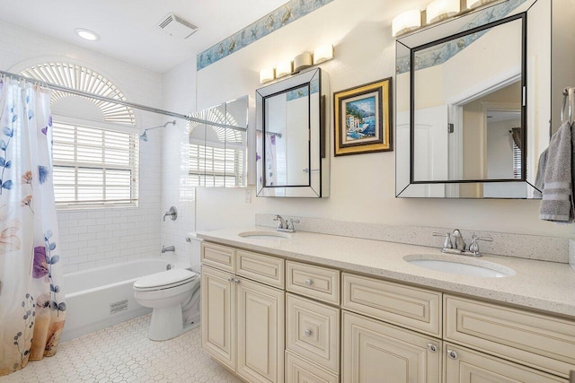 full bathroom with shower / bath combo, tile patterned flooring, vanity, and toilet