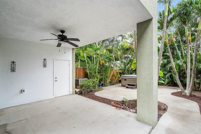 view of patio with a hot tub and ceiling fan