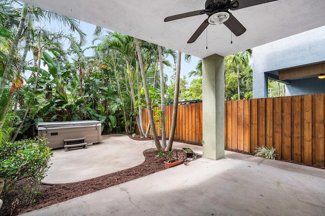 view of patio featuring a hot tub and ceiling fan