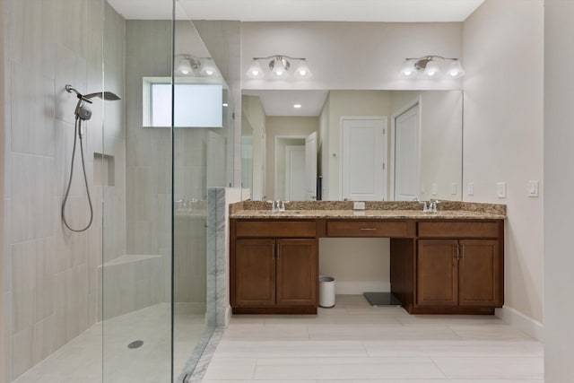 bathroom featuring vanity and a tile shower