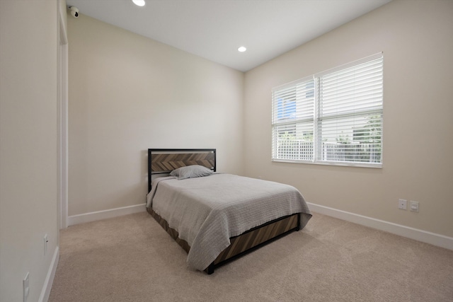 bedroom with light carpet