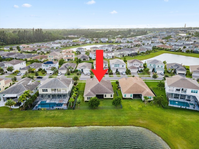 birds eye view of property with a water view