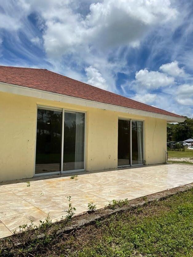 rear view of property featuring a patio