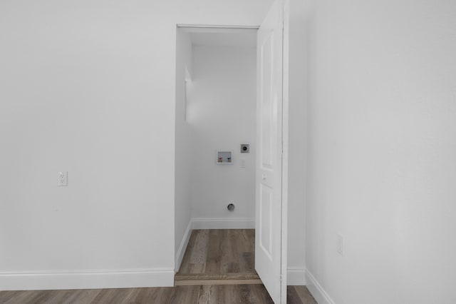 clothes washing area with washer hookup, electric dryer hookup, and dark hardwood / wood-style floors