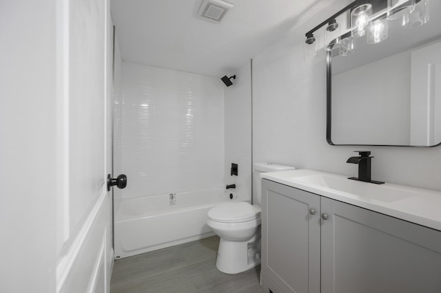 full bathroom with vanity, toilet, and shower / washtub combination