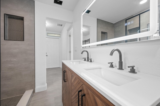 bathroom featuring vanity and walk in shower