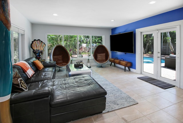 living room with french doors and light tile patterned floors