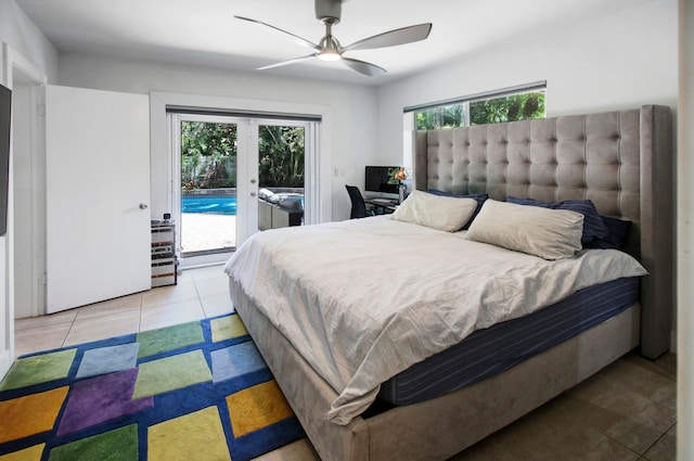 tiled bedroom featuring ceiling fan, multiple windows, french doors, and access to outside