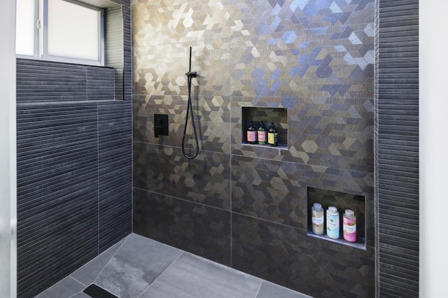 bathroom with tiled shower