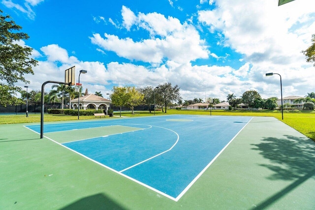 view of basketball court featuring a lawn and a gazebo