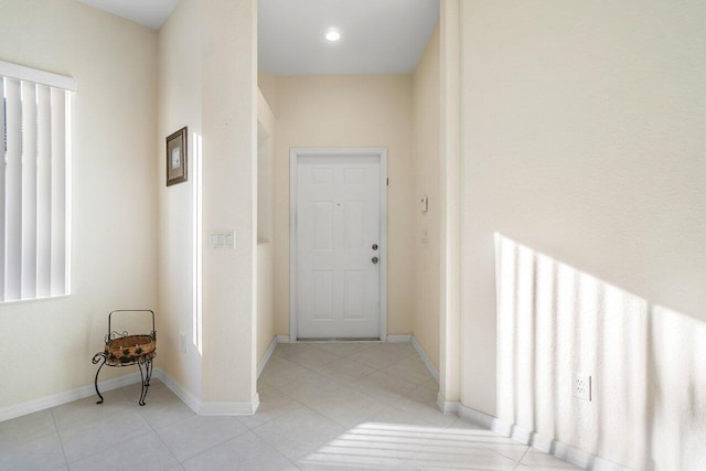 hallway featuring light tile patterned floors