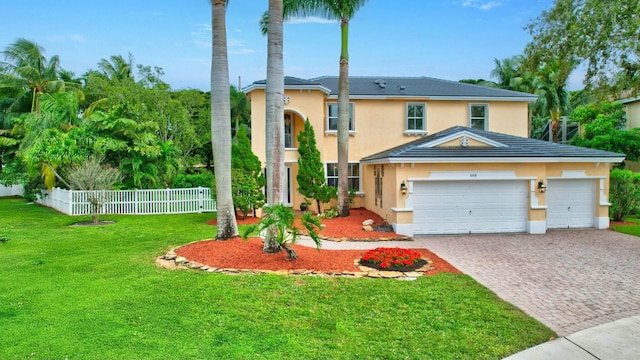 view of front facade featuring a garage and a front yard