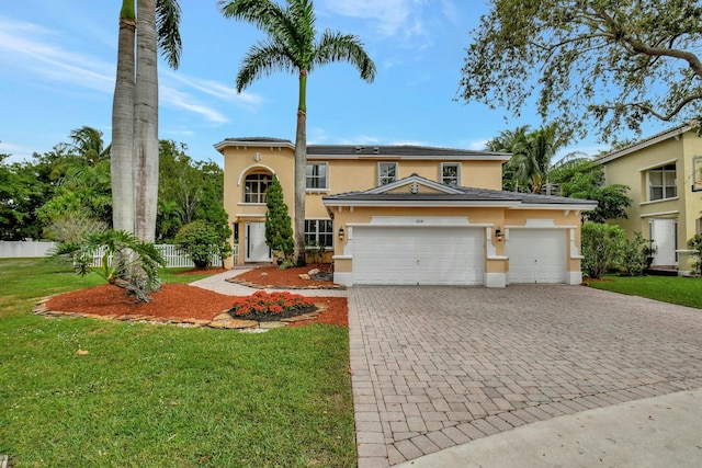 view of front facade with a garage and a front yard