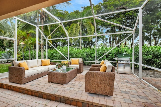 view of patio featuring a lanai, a grill, and an outdoor hangout area