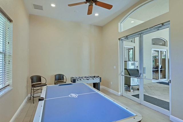 recreation room with french doors, light hardwood / wood-style flooring, and ceiling fan