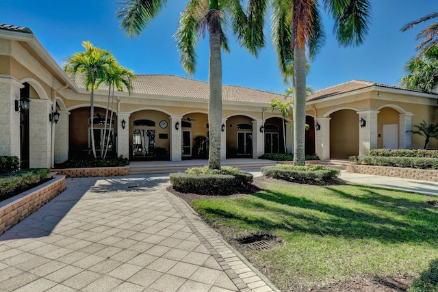 mediterranean / spanish home with covered porch