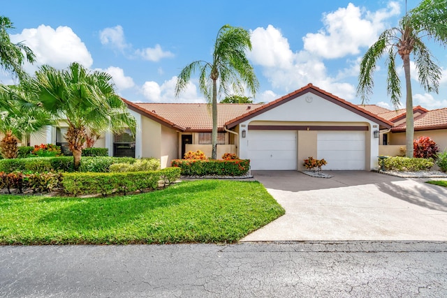 ranch-style home with a garage and a front yard