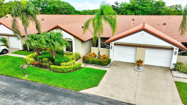 view of front facade featuring a garage and a front yard