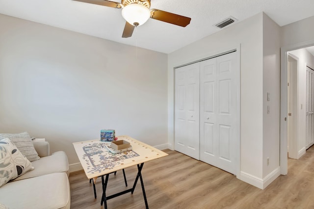 office area featuring ceiling fan and light wood-type flooring