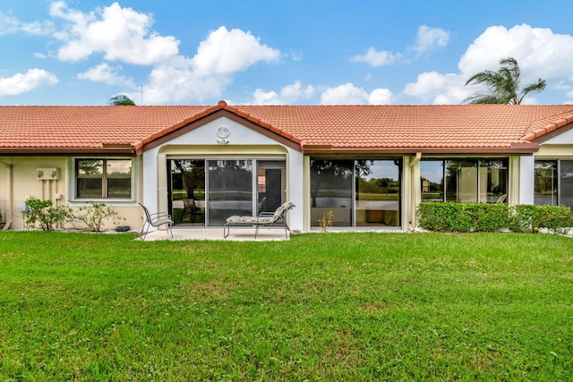 8306 Mooring Cir, Boynton Beach, FL 33472 - back of property featuring a tiled roof, a yard, and stucco siding