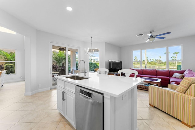 kitchen with white cabinets, sink, pendant lighting, dishwasher, and an island with sink