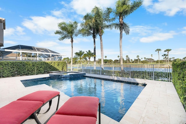 view of swimming pool featuring a water view, an in ground hot tub, and a patio