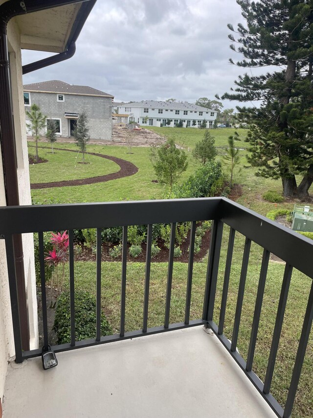 view of front facade with central AC unit and a front yard