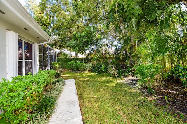 view of yard with a lanai